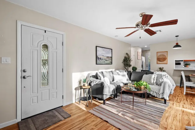 a living room with furniture and a fireplace