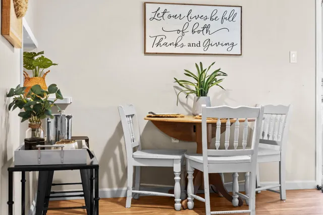 a kitchen with stainless steel appliances granite countertop a refrigerator a sink and wooden cabinets