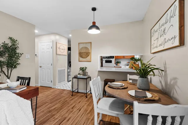 a kitchen with stainless steel appliances granite countertop a sink a stove and cabinets