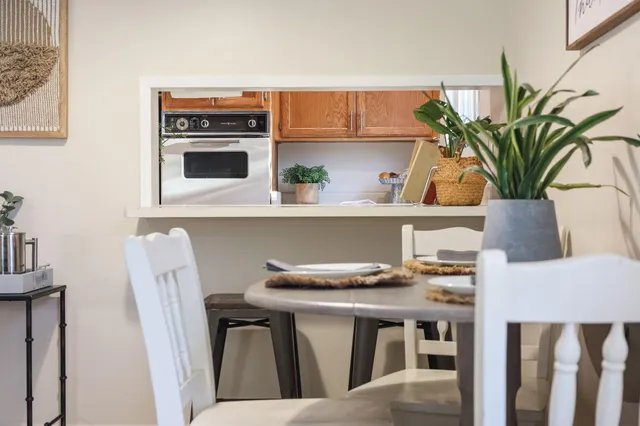 a kitchen with stainless steel appliances a refrigerator and a stove