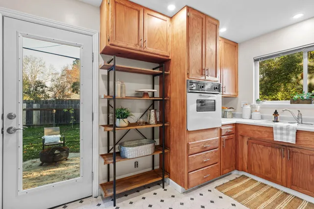 a bedroom with a bed and a potted plant
