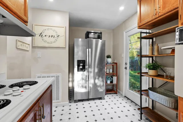 a bedroom with two beds and a chandelier
