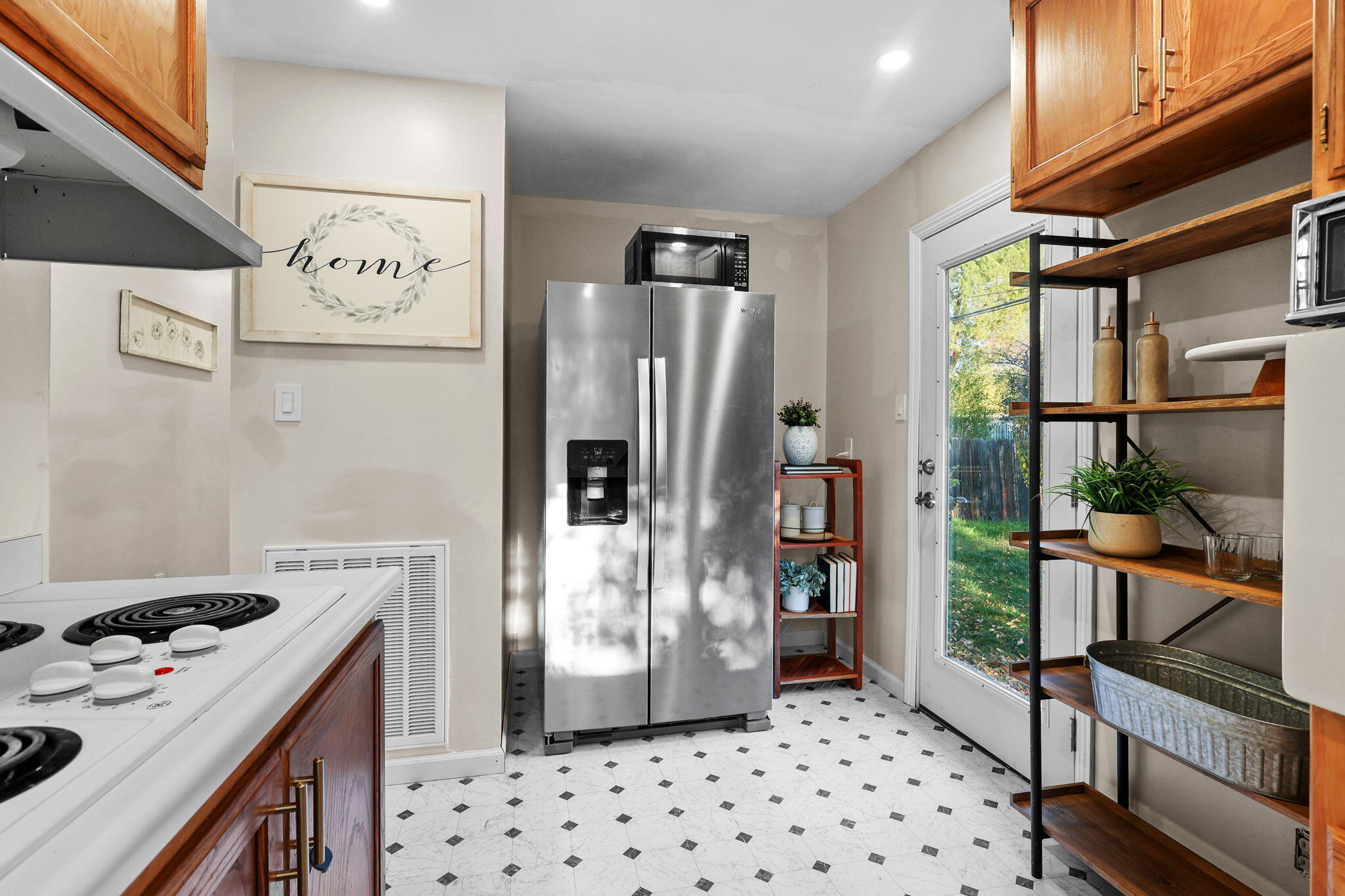 755 Christine Avenue Redding, CA 96003 - Photo 30 of 58 a kitchen with stainless steel appliances a refrigerator and a stove