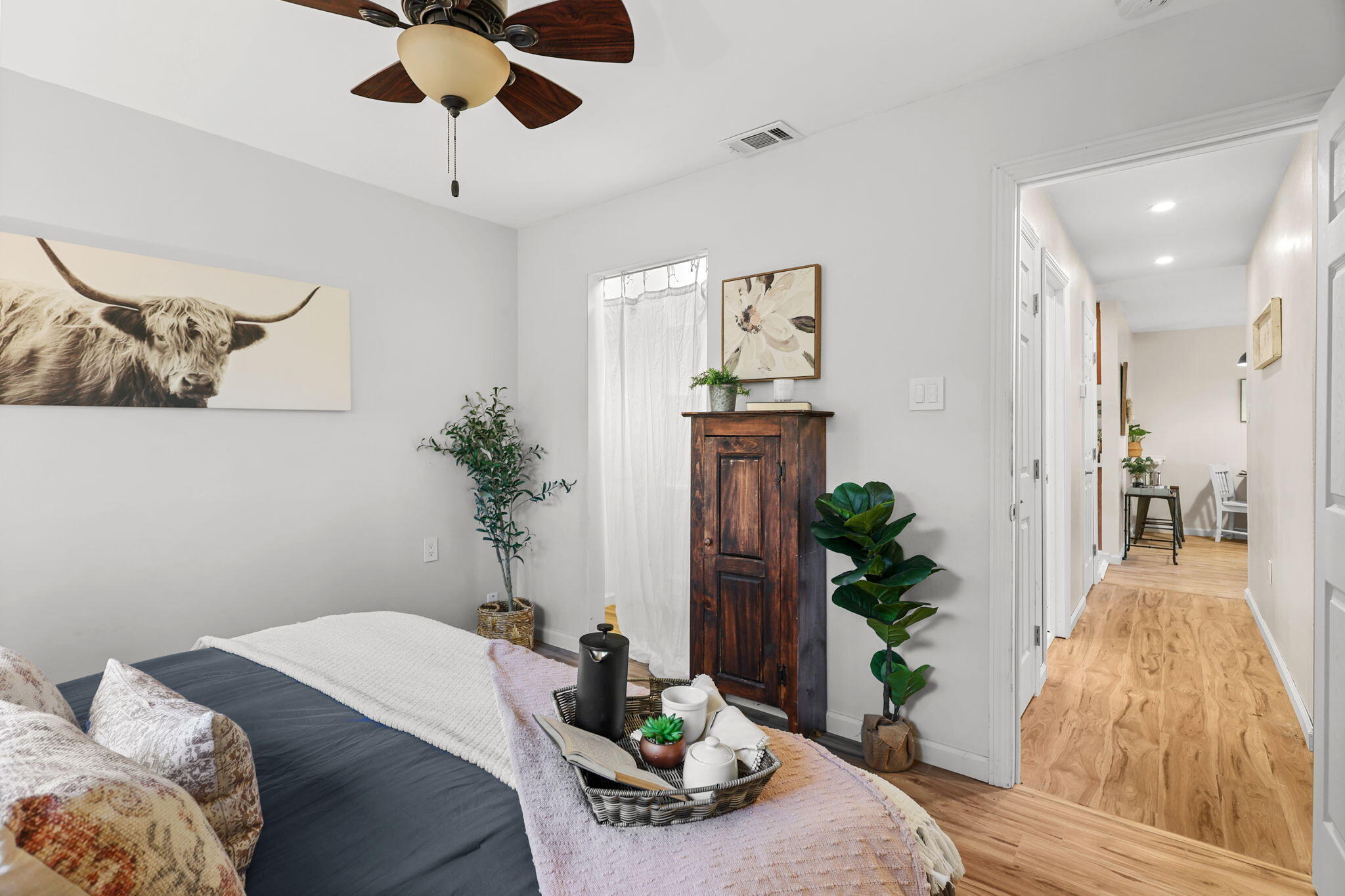 755 Christine Avenue Redding, CA 96003 - Photo 32 of 58 a bedroom with a bed and a potted plant