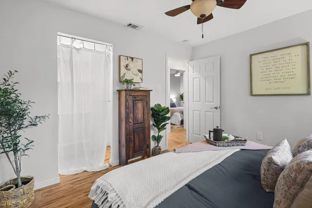 a bedroom with a bed and a table