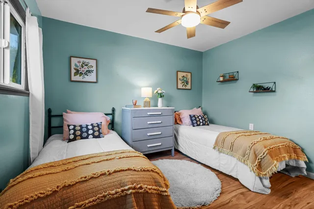 a bathroom with a double vanity sink mirror and toilet