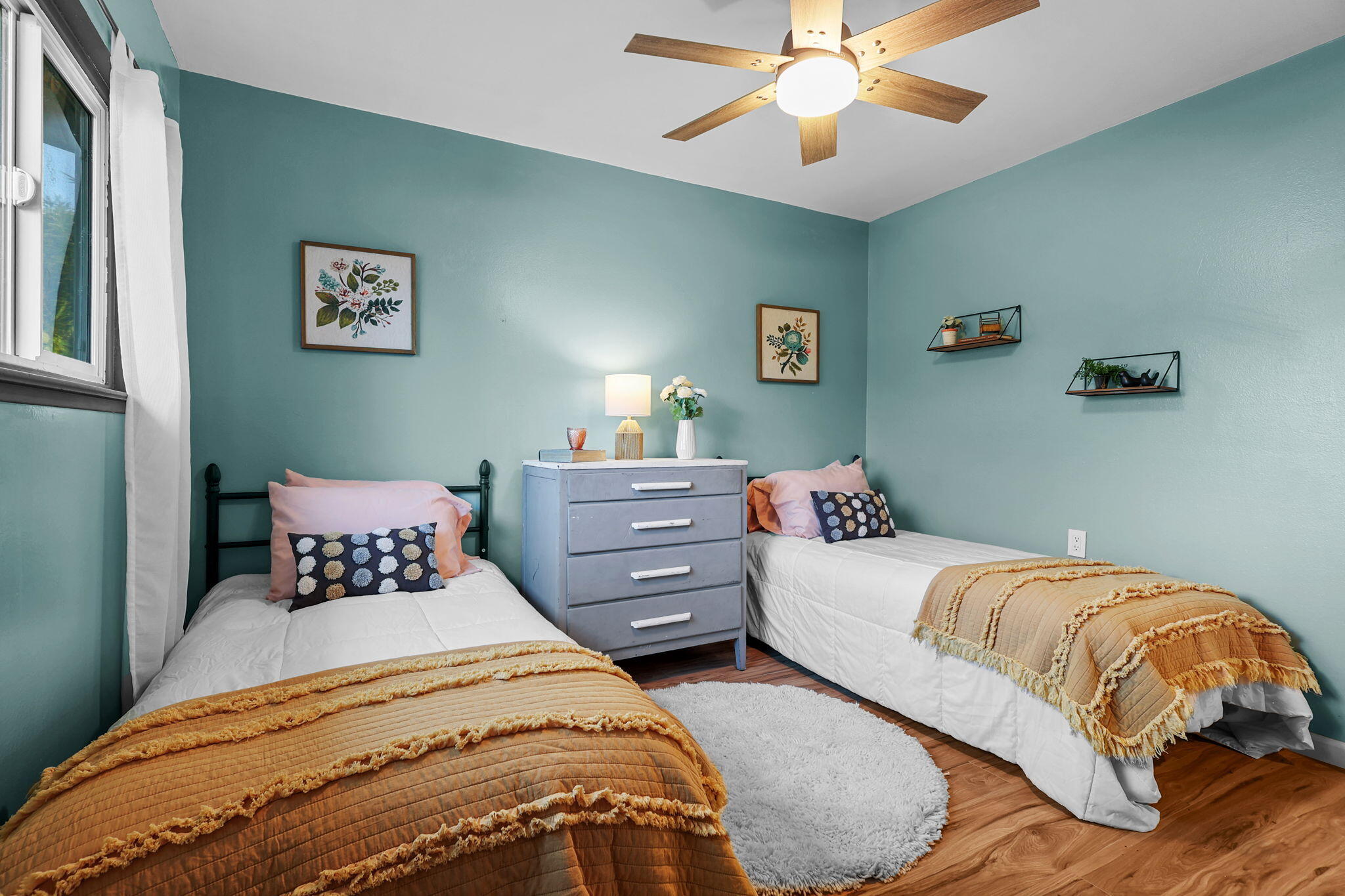 755 Christine Avenue Redding, CA 96003 - Photo 34 of 58 a bedroom with two beds and a chandelier