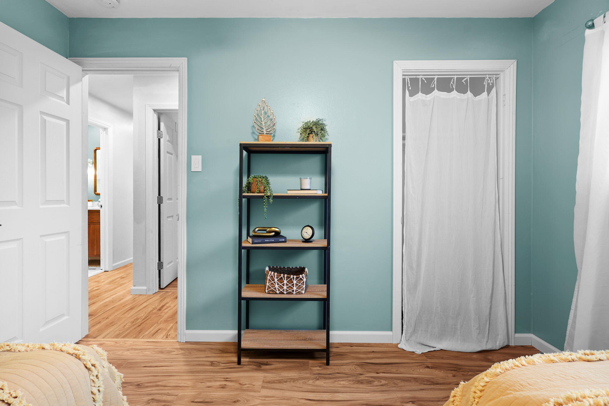 755 Christine Avenue Redding, CA 96003 - Photo 35 of 58 a bedroom with a bed and a wooden floor