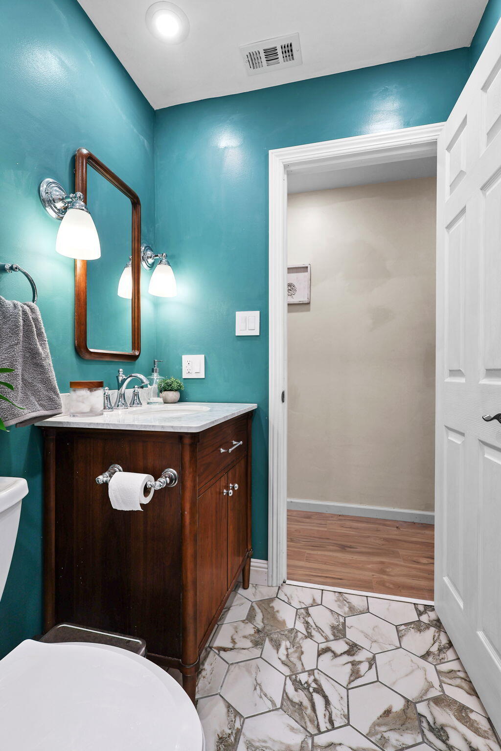 755 Christine Avenue Redding, CA 96003 - Photo 39 of 58 a bathroom with a sink a toilet a mirror and vanity