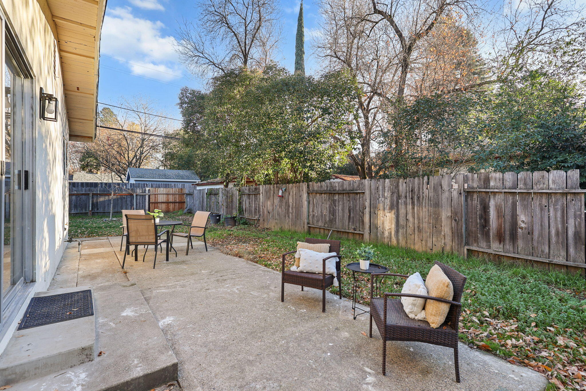 755 Christine Avenue Redding, CA 96003 - Photo 43 of 58 a view of a chairs and tables in the back yard of the house
