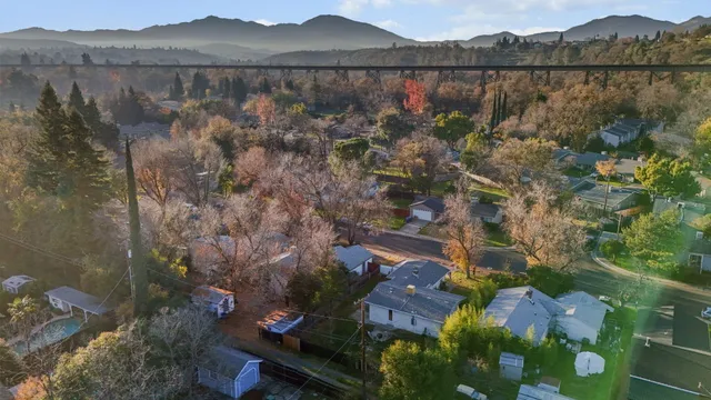 an aerial view of residential houses with outdoor space