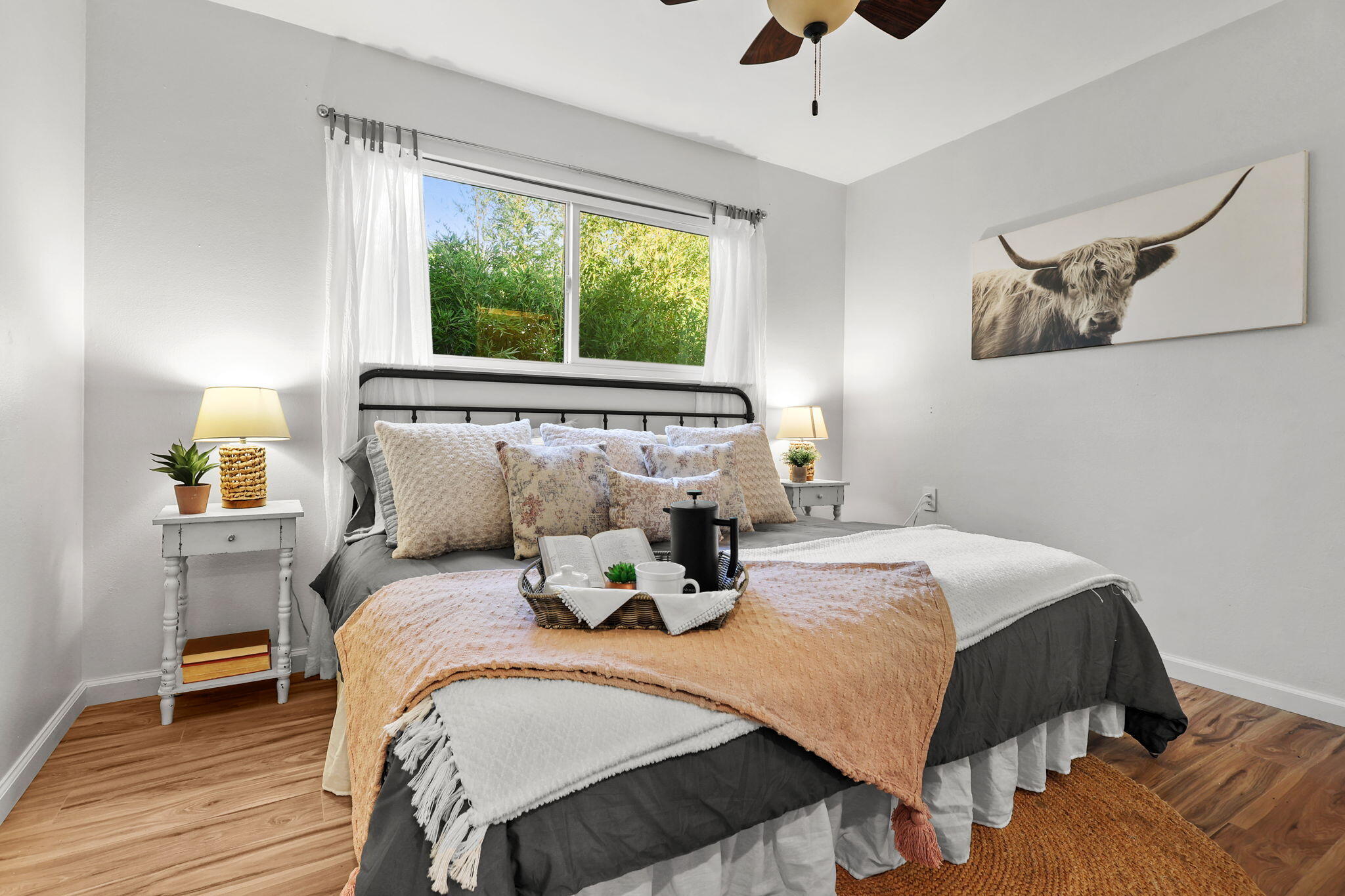 755 Christine Avenue Redding, CA 96003 - Photo 7 of 58 a bedroom with a bed and wooden floor