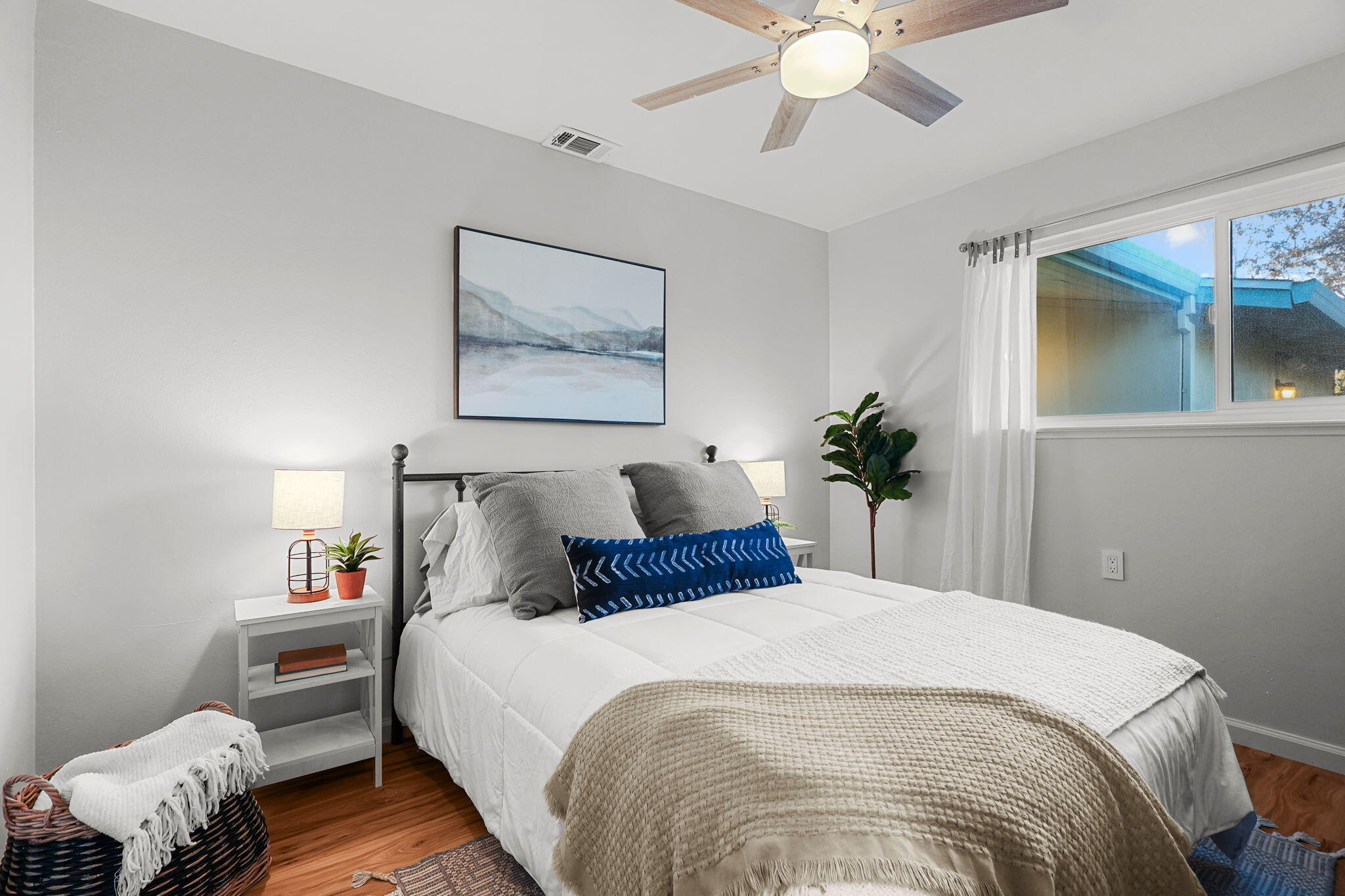 755 Christine Avenue Redding, CA 96003 - Photo 9 of 58 a bedroom with a bed and a chandelier