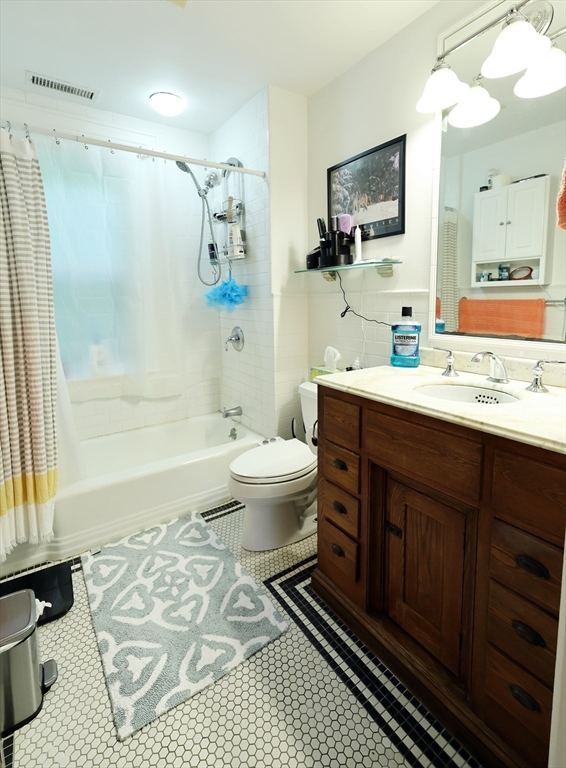 107 Waban Hill Road, Unit R Newton, MA 02467 - Photo 13 of 21 a bathroom with a sink toilet a mirror and shower