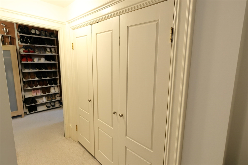 107 Waban Hill Road, Unit R Newton, MA 02467 - Photo 18 of 21 a view of closet area with stairs
