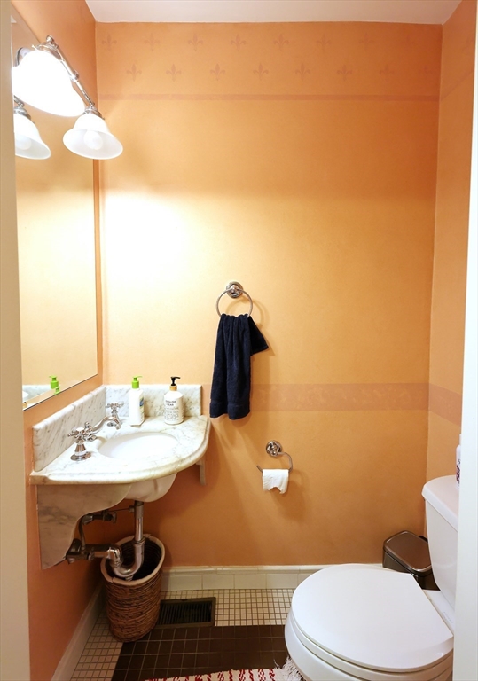 107 Waban Hill Road, Unit R Newton, MA 02467 - Photo 19 of 21 a bathroom with a sink a toilet and a mirror