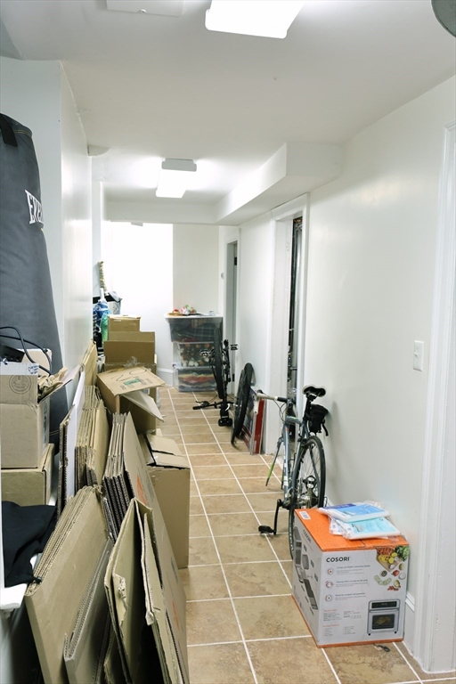 107 Waban Hill Road, Unit R Newton, MA 02467 - Photo 20 of 21 a room with gym equipment and many windows