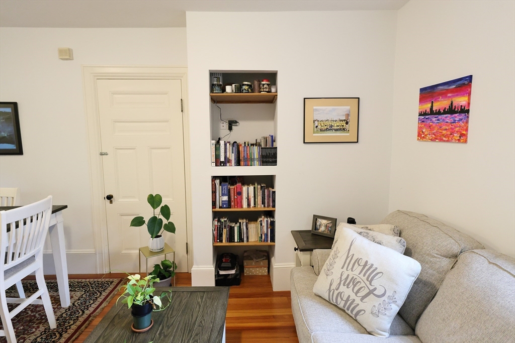107 Waban Hill Road, Unit R Newton, MA 02467 - Photo 6 of 21 a living room with furniture and a book shelf