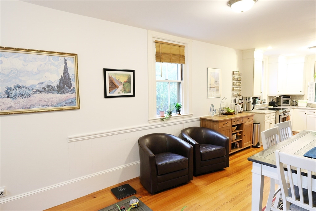 107 Waban Hill Road, Unit R Newton, MA 02467 - Photo 7 of 21 a living room with furniture and a window