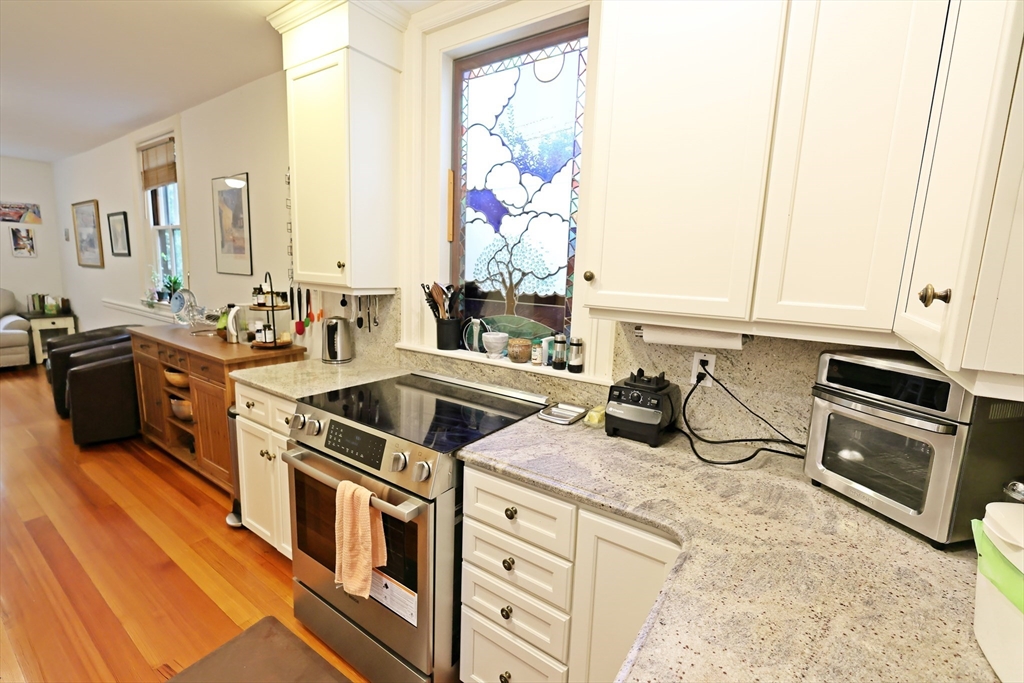 107 Waban Hill Road, Unit R Newton, MA 02467 - Photo 9 of 21 a kitchen that has a stove and a sink