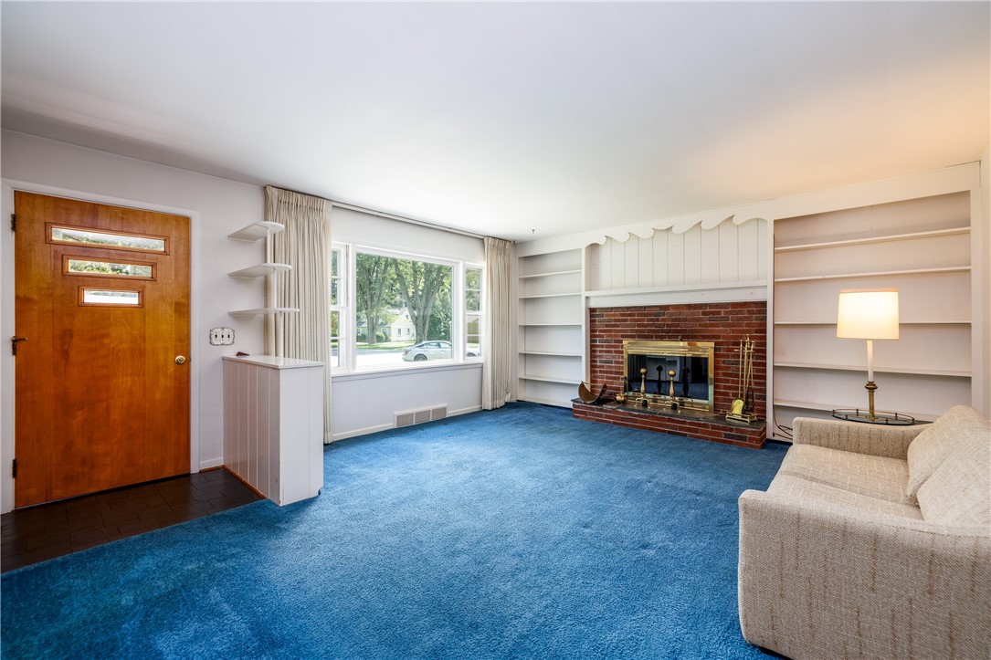 294 Ridgeview Drive Perinton, NY 14445 - Photo 8 of 36 Entry area into formal living room with wood burni