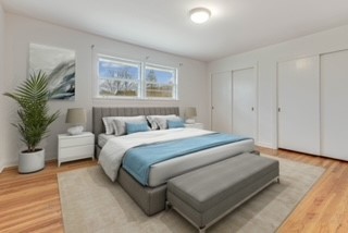 216 Green Bay Road Lake Bluff, IL 60044 - Photo 14 of 35 a bedroom with a large bed a potted plant and a window