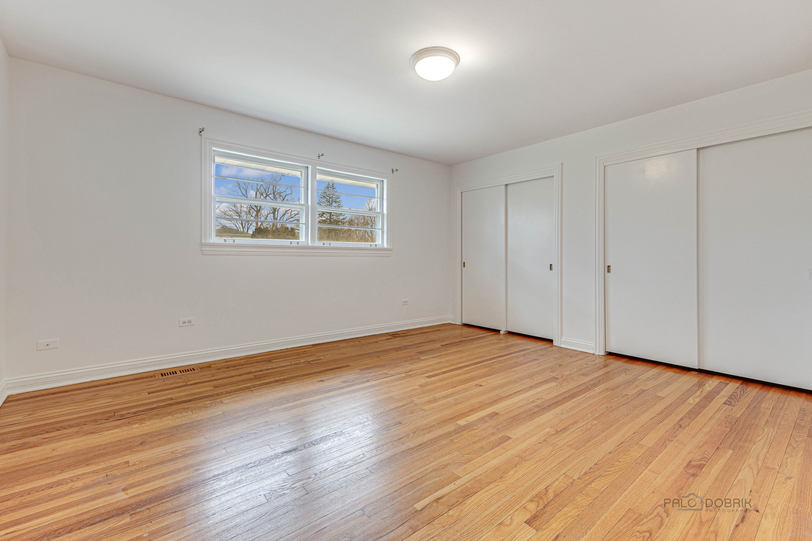 216 Green Bay Road Lake Bluff, IL 60044 - Photo 16 of 35 a view of an empty room with wooden floor and a window