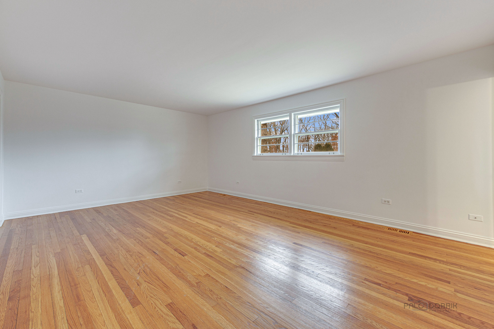 216 Green Bay Road Lake Bluff, IL 60044 - Photo 17 of 35 a view of empty room with wooden floor and fan