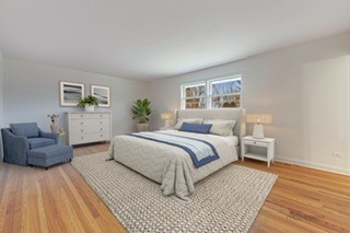 216 Green Bay Road Lake Bluff, IL 60044 - Photo 18 of 35 a spacious bedroom with a bed and a couch