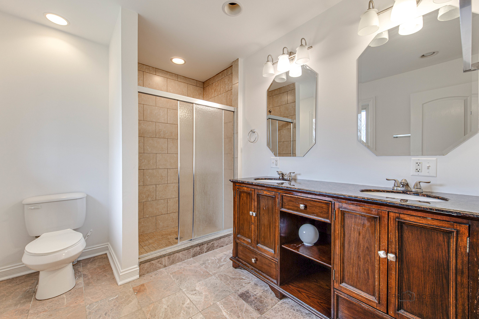 216 Green Bay Road Lake Bluff, IL 60044 - Photo 27 of 35 a spacious bathroom with a toilet a sink and mirror