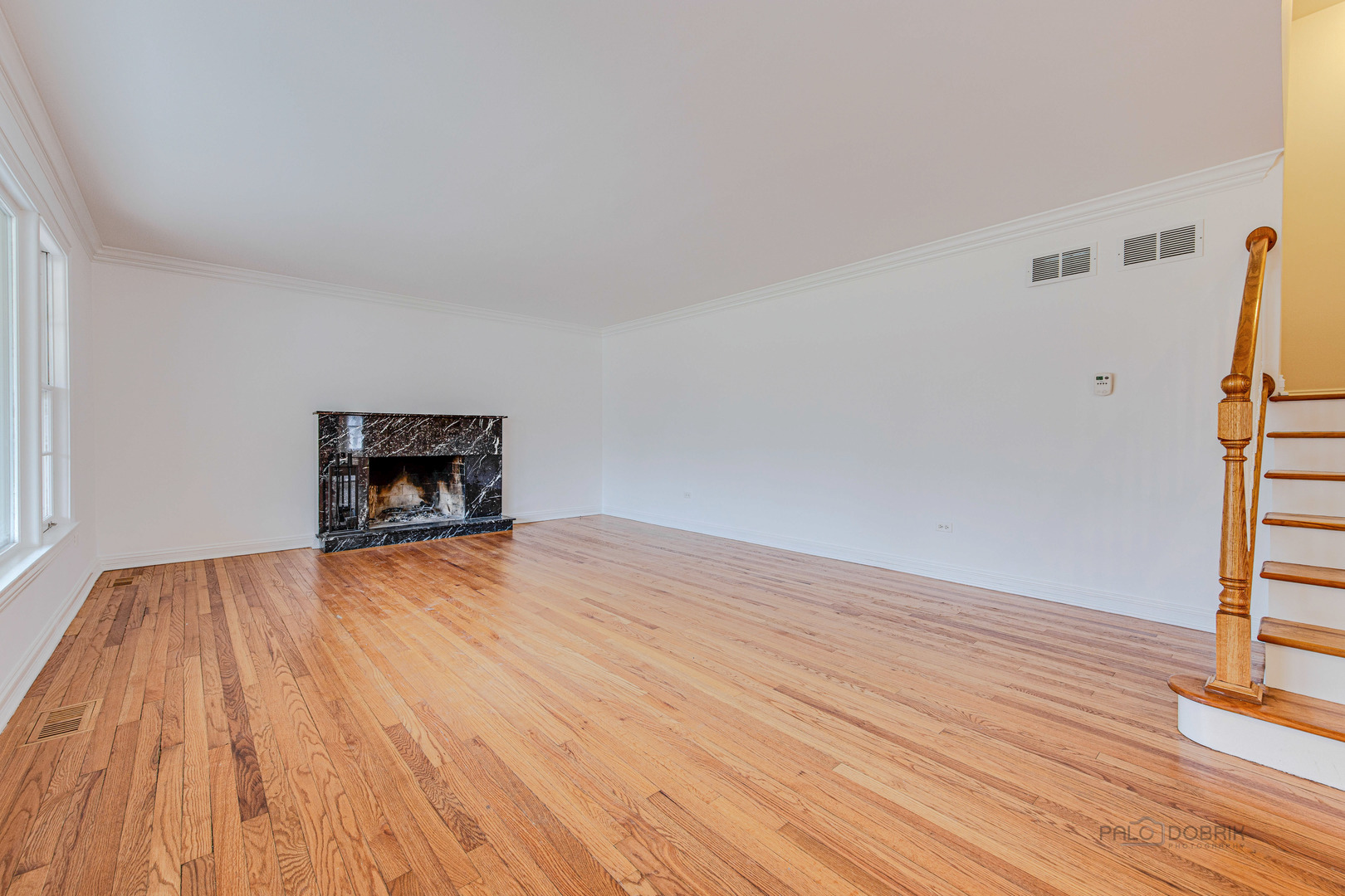 216 Green Bay Road Lake Bluff, IL 60044 - Photo 4 of 35 a view of empty room with wooden floor and fireplace