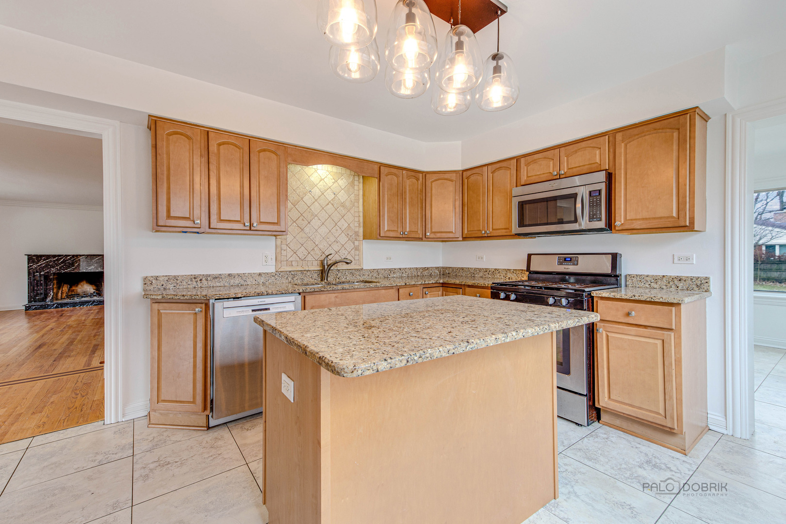 216 Green Bay Road Lake Bluff, IL 60044 - Photo 9 of 35 a kitchen with stainless steel appliances granite countertop a stove top oven a sink a counter top space and cabinets