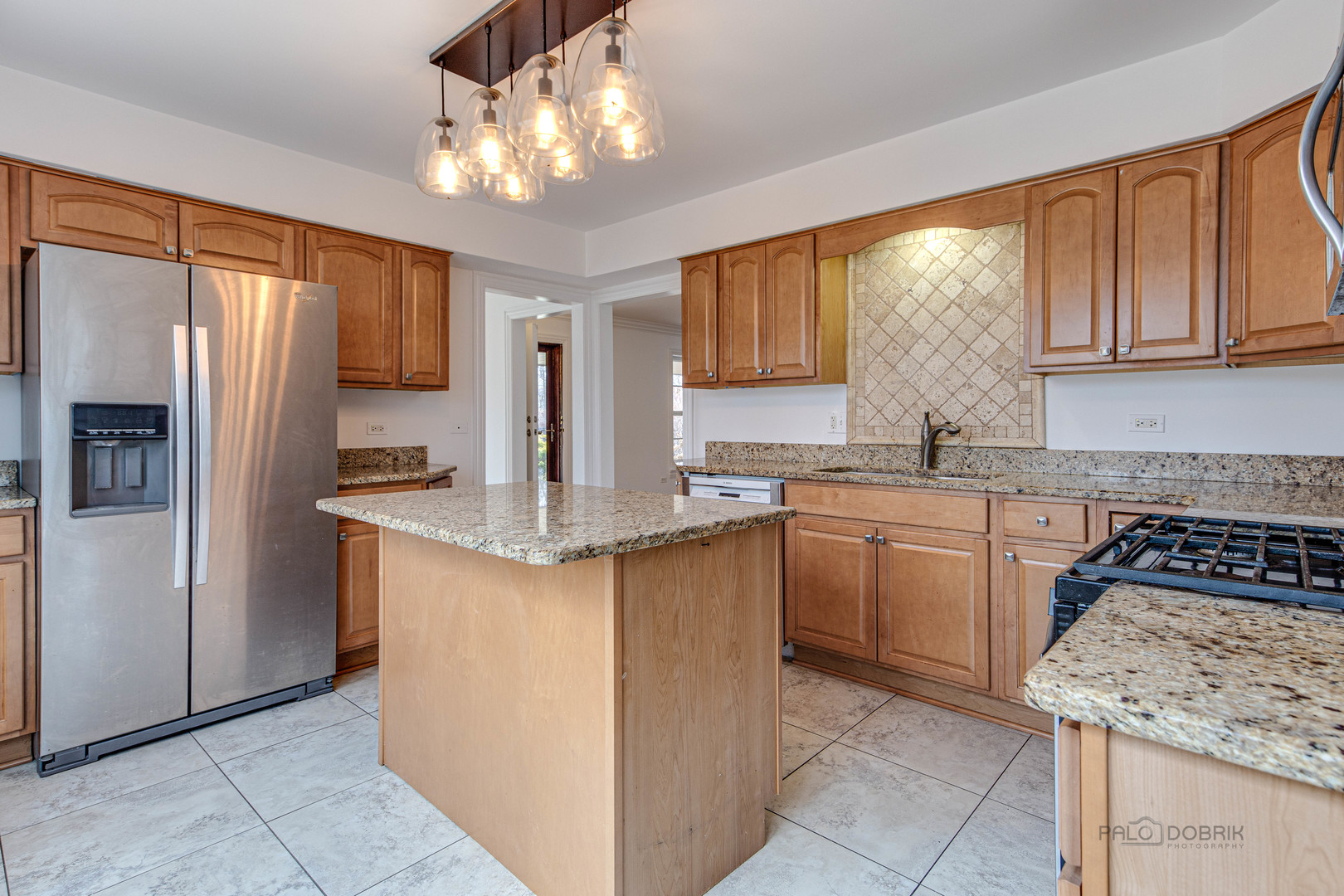 216 Green Bay Road Lake Bluff, IL 60044 - Photo 10 of 35 a kitchen with stainless steel appliances granite countertop a stove top oven a refrigerator a sink and dishwasher with a dishwasher