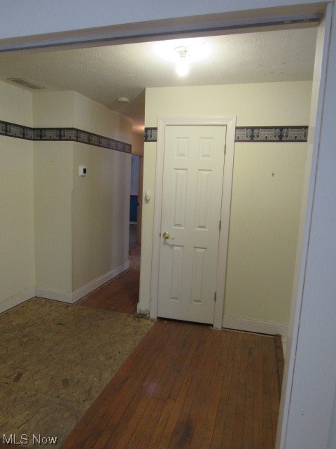 3102 State Road Vermilion, OH 44089 - Photo 29 of 45 Hallway with dark hardwood / wood-style floors