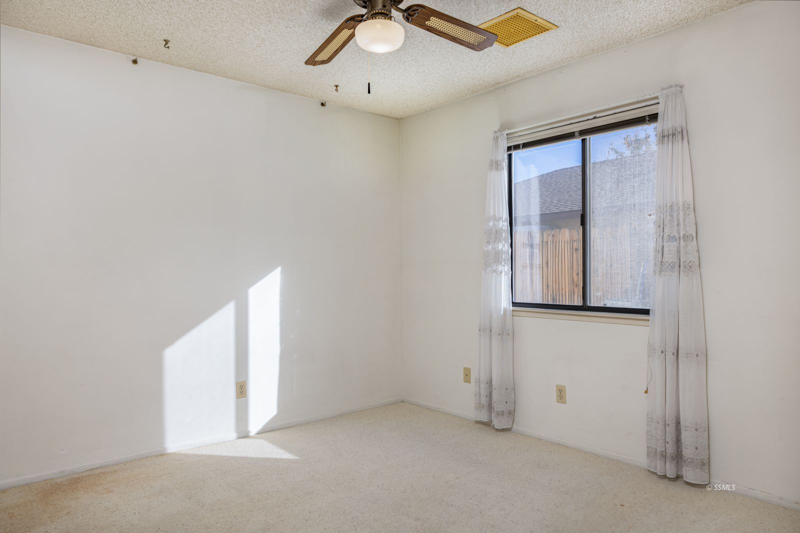 135 Chambers Street Ridgecrest, CA 93555 - Photo 17 of 26 a view of an empty room with a window