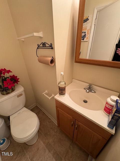 706 Orchard Drive Graham, NC 27253 - Photo 11 of 18 a bathroom with a sink a toilet and mirror