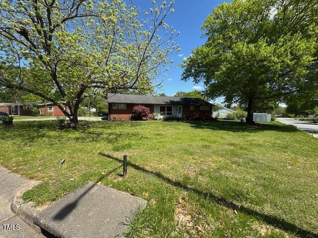 706 Orchard Drive Graham, NC 27253 - Photo 2 of 18 a view of a house with a yard