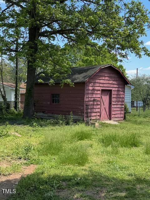 706 Orchard Drive Graham, NC 27253 - Photo 5 of 18 a couple of potted plants in front of a tree