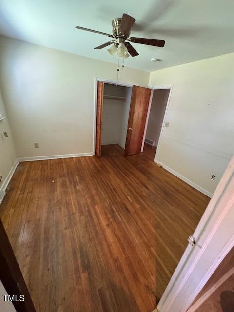 706 Orchard Drive Graham, NC 27253 - Photo 8 of 18 a view of a livingroom with a ceiling fan and hardwood floor