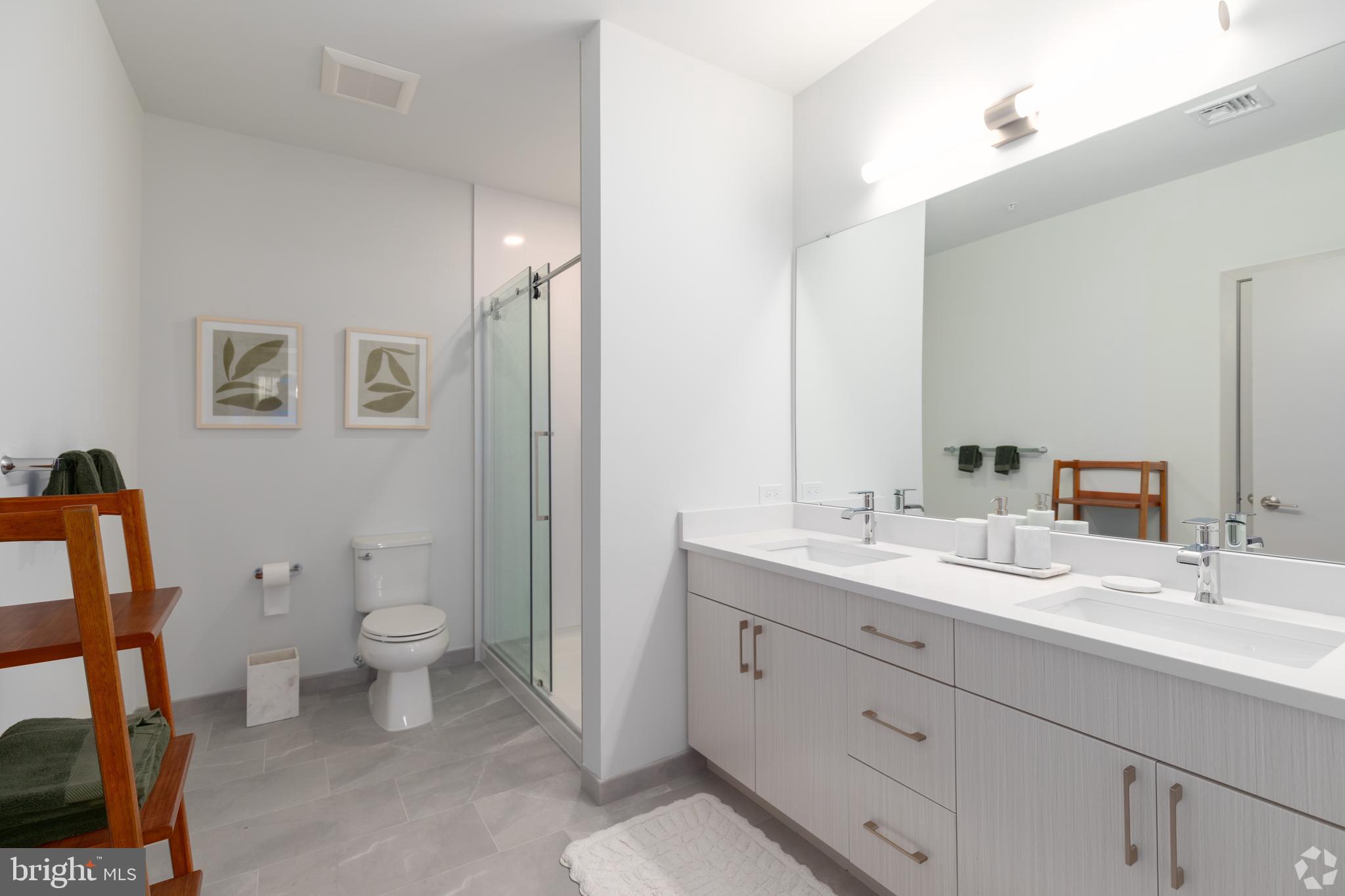 6461 Highway 9, Unit 142 Howell, NJ 07731 - Photo 14 of 29 a bathroom with a toilet sink and mirror