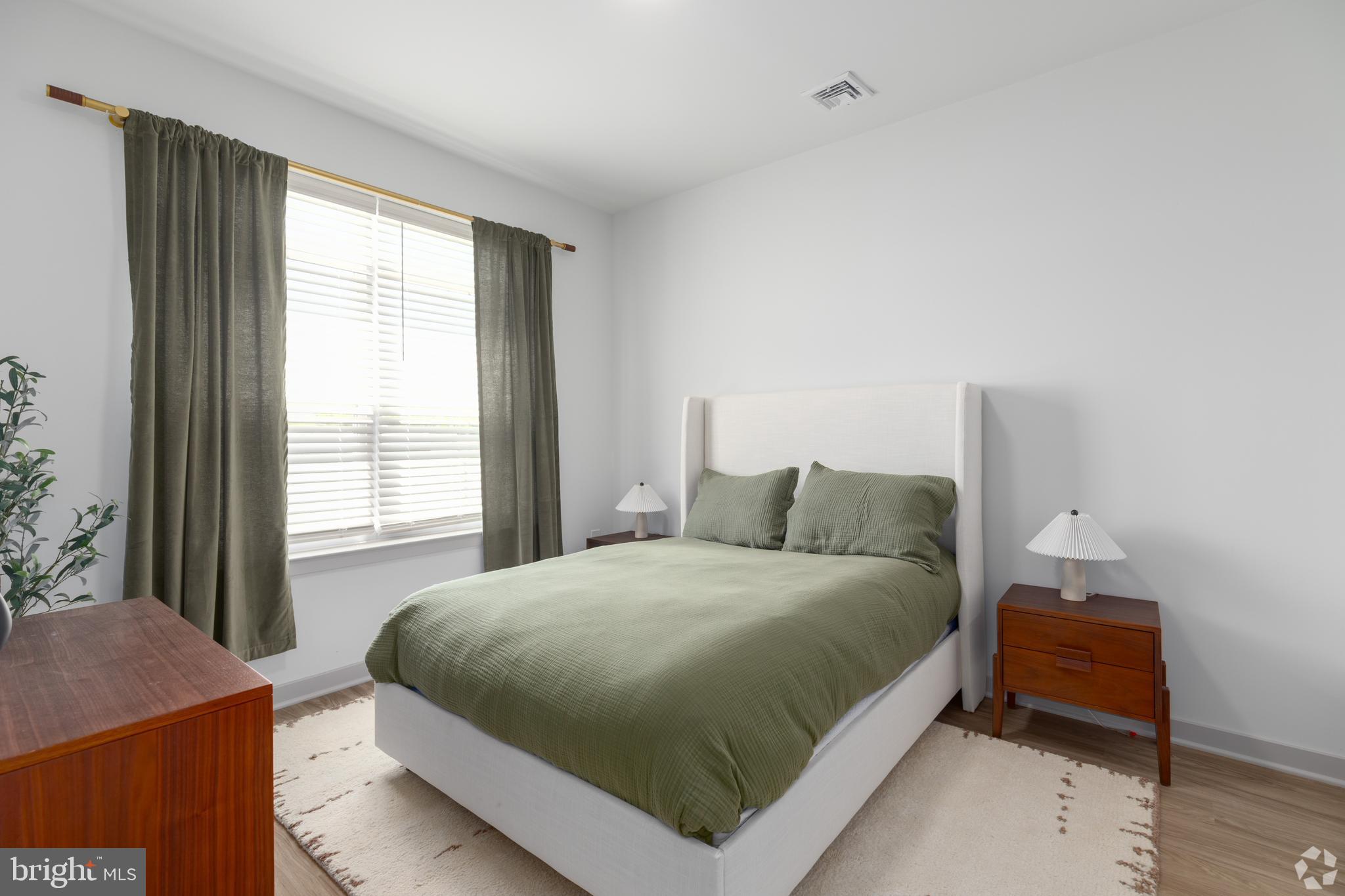 6461 Highway 9, Unit 142 Howell, NJ 07731 - Photo 17 of 29 a bedroom with a bed and a window