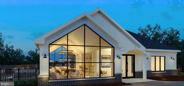 a living room with lots of furniture and kitchen view