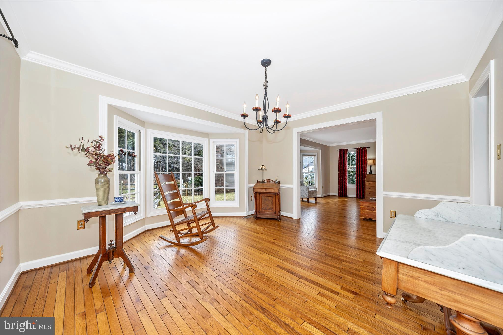6135 Cornwall Place Frederick, MD 21701 - Photo 12 of 81 a view of a livingroom with furniture wooden floor and a chandelier