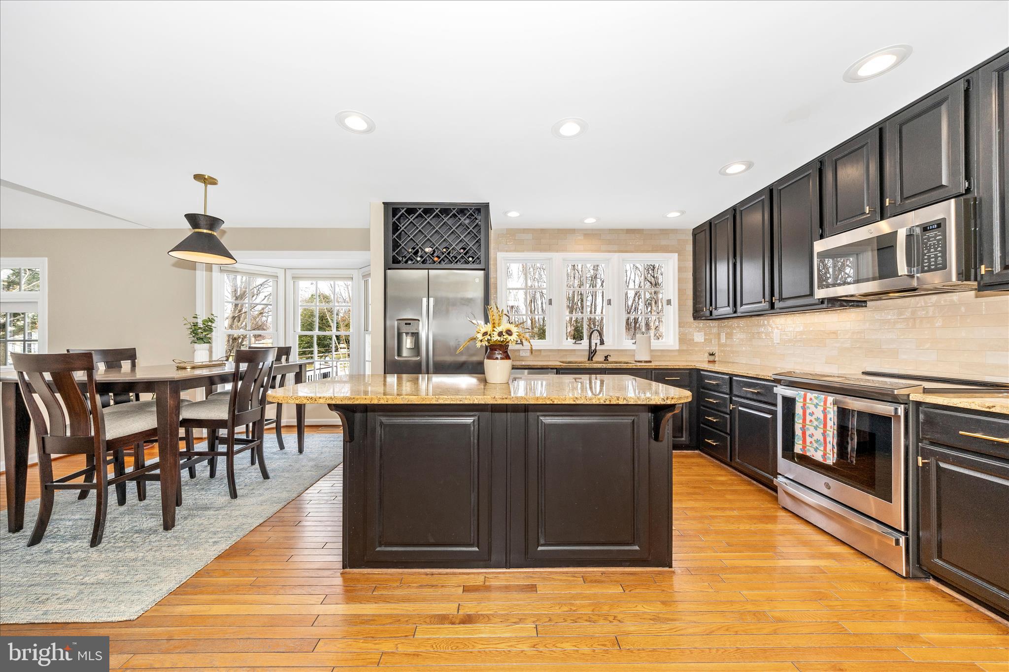 6135 Cornwall Place Frederick, MD 21701 - Photo 14 of 81 a kitchen with stainless steel appliances granite countertop a stove and a sink