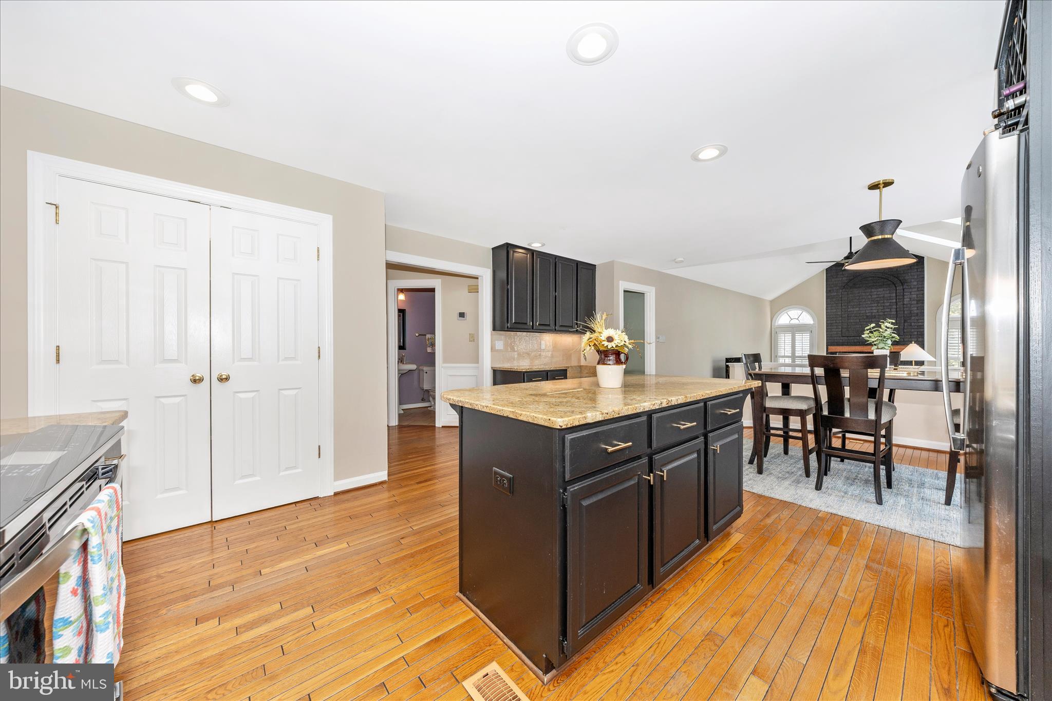 6135 Cornwall Place Frederick, MD 21701 - Photo 17 of 81 a kitchen with stainless steel appliances granite countertop a sink and a refrigerator