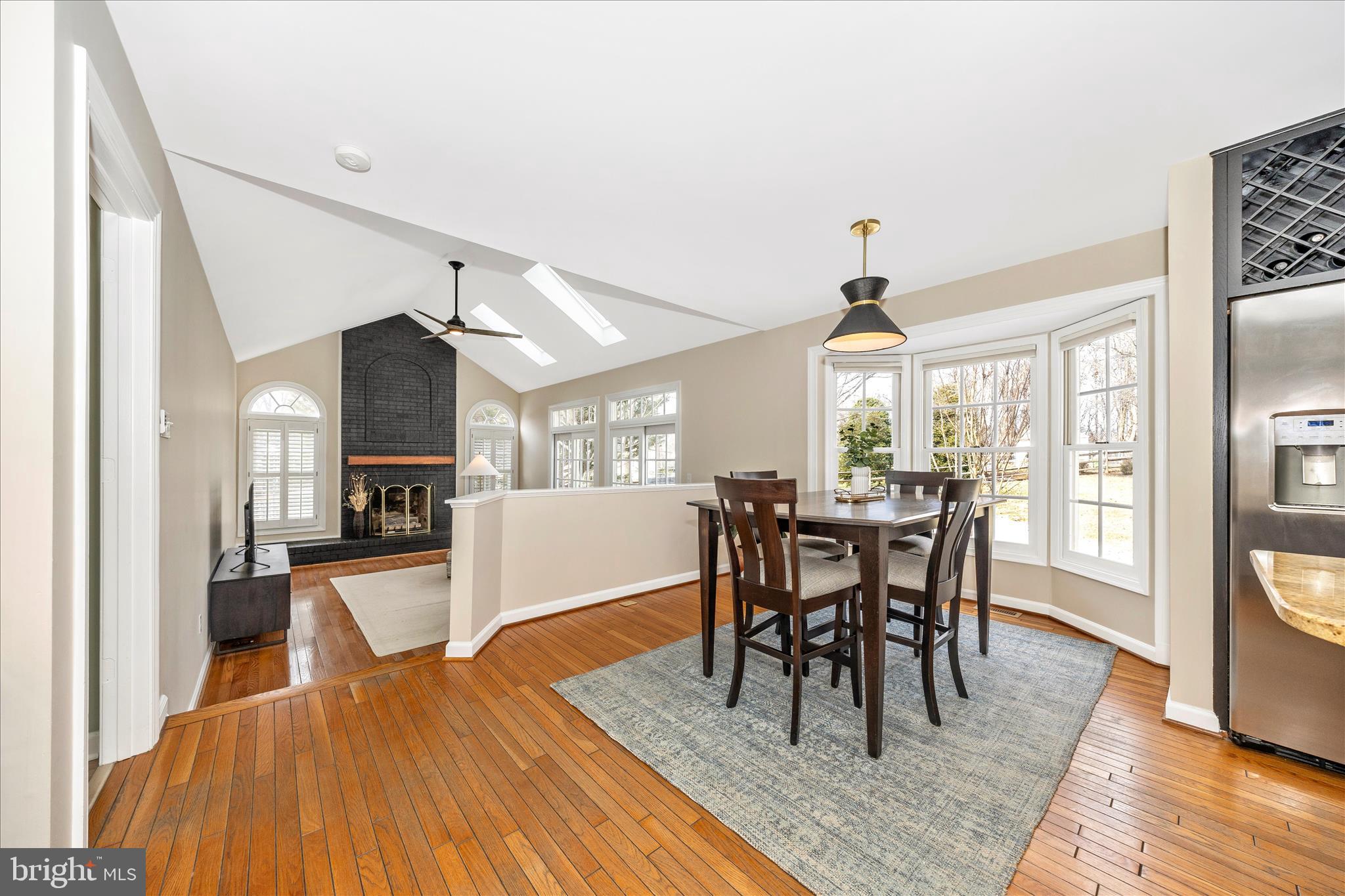 6135 Cornwall Place Frederick, MD 21701 - Photo 18 of 81 a view of a dining room with furniture window and wooden floor