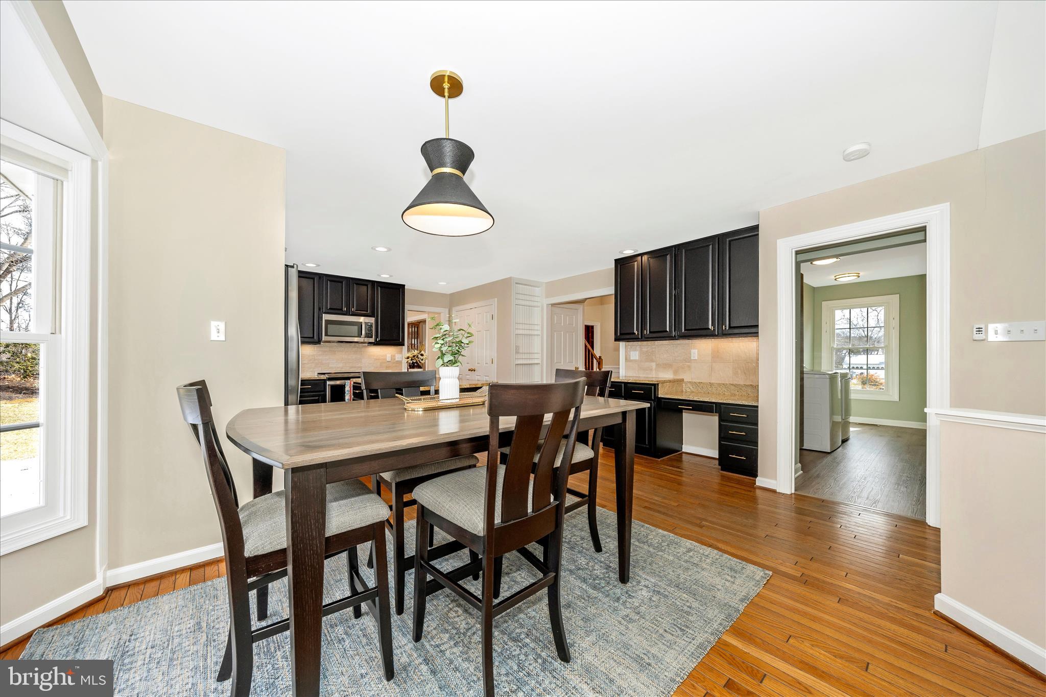 6135 Cornwall Place Frederick, MD 21701 - Photo 20 of 81 a view of a dining room with furniture and wooden floor