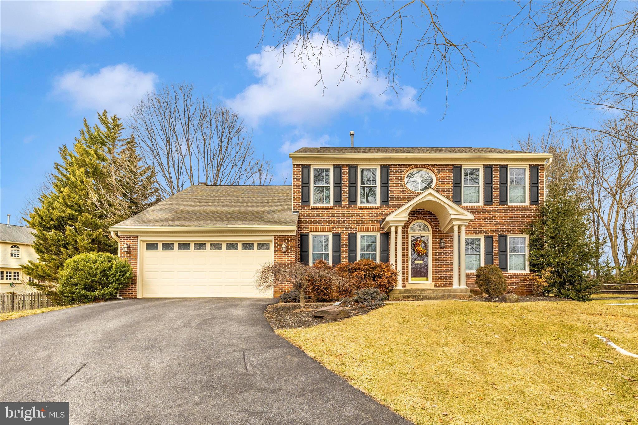 6135 Cornwall Place Frederick, MD 21701 - Photo 2 of 81 a front view of a house with a yard