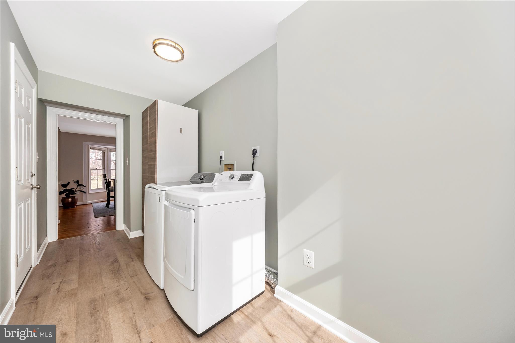 6135 Cornwall Place Frederick, MD 21701 - Photo 27 of 81 a view of a hallway with washer and dryer