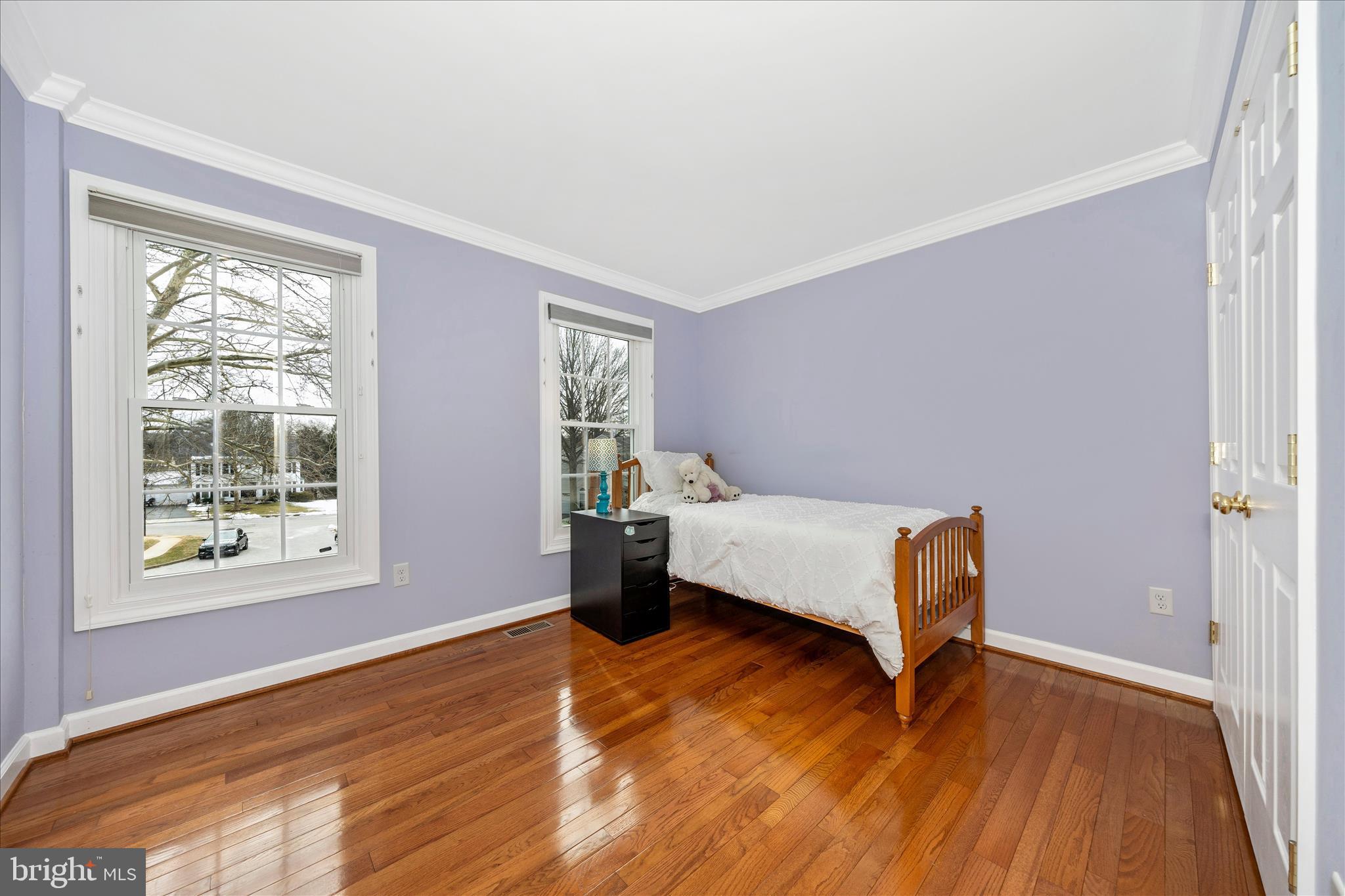 6135 Cornwall Place Frederick, MD 21701 - Photo 35 of 81 a bedroom with a bed and wooden floor